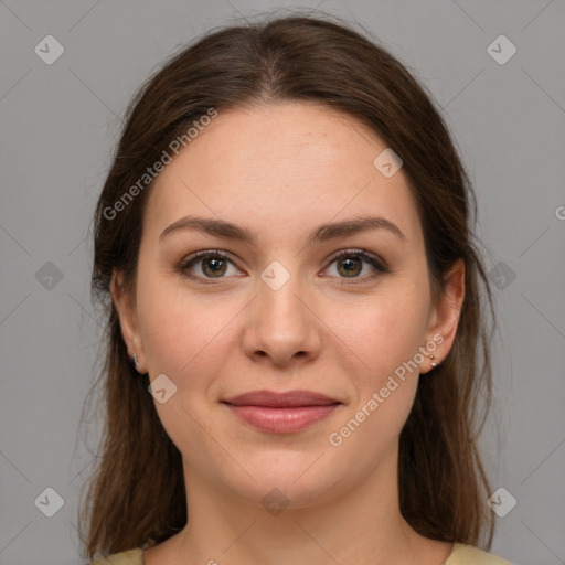 Joyful white young-adult female with medium  brown hair and grey eyes