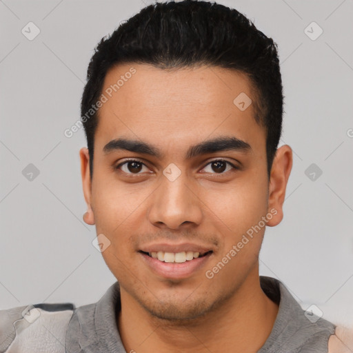 Joyful latino young-adult male with short  black hair and brown eyes