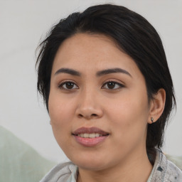 Joyful asian young-adult female with medium  black hair and brown eyes