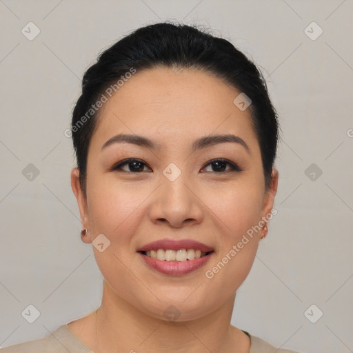 Joyful asian young-adult female with short  black hair and brown eyes