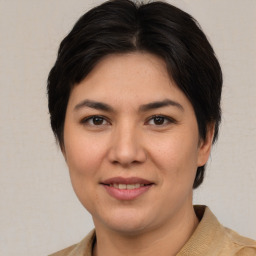 Joyful white young-adult female with medium  brown hair and brown eyes