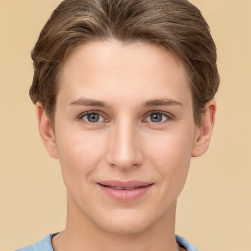 Joyful white young-adult female with short  brown hair and grey eyes