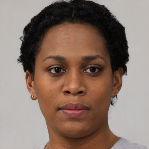 Neutral black young-adult female with short  brown hair and brown eyes
