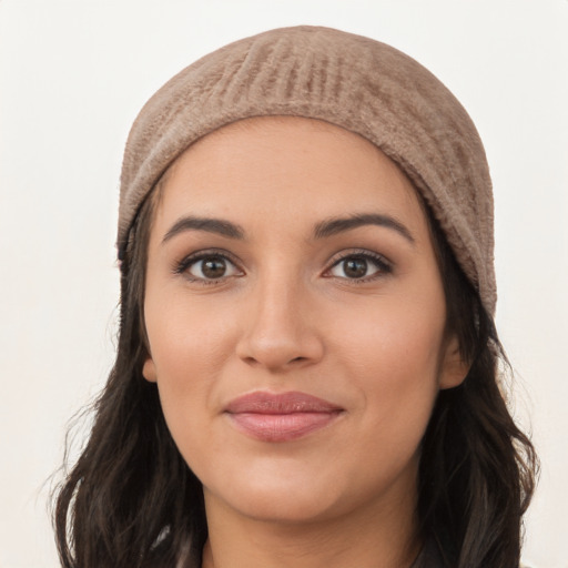 Joyful white young-adult female with long  black hair and brown eyes