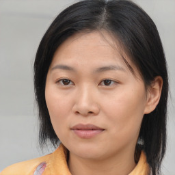 Neutral asian young-adult female with medium  brown hair and brown eyes