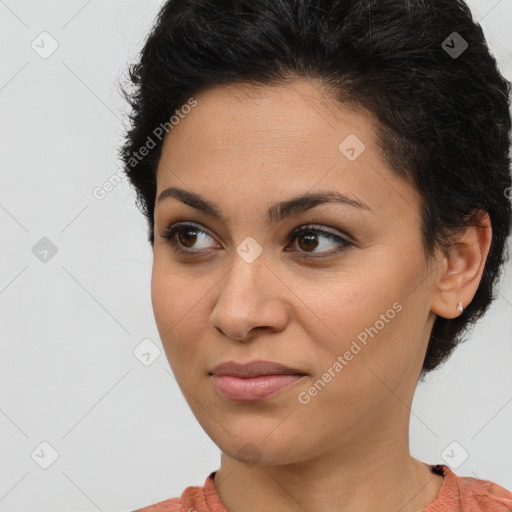 Joyful latino young-adult female with short  brown hair and brown eyes