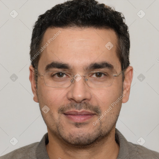 Joyful white adult male with short  black hair and brown eyes