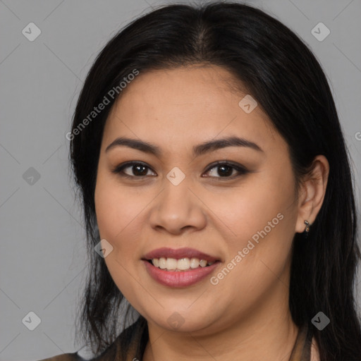 Joyful latino young-adult female with long  brown hair and brown eyes