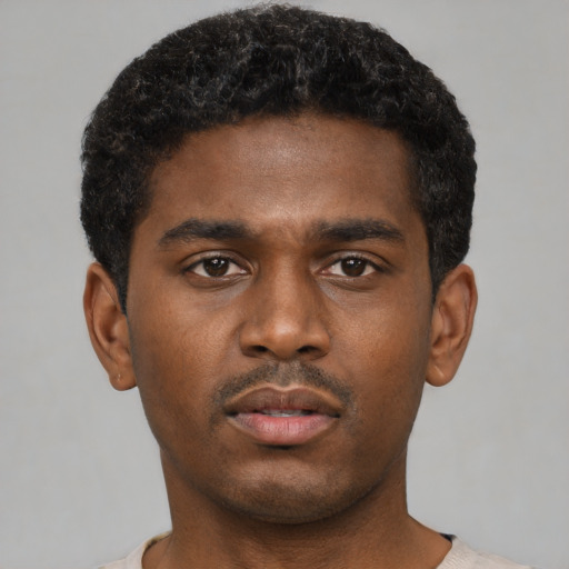 Neutral black young-adult male with short  black hair and brown eyes