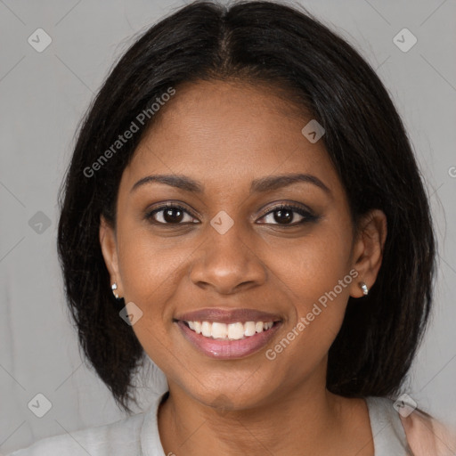 Joyful black young-adult female with medium  brown hair and brown eyes