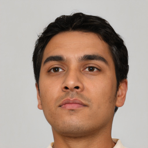 Neutral latino young-adult male with short  black hair and brown eyes