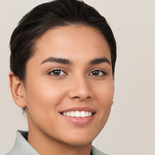 Joyful white young-adult female with short  brown hair and brown eyes