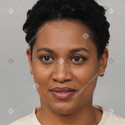 Joyful black young-adult female with short  black hair and brown eyes