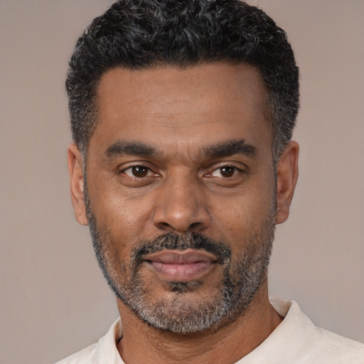 Neutral latino adult male with short  black hair and brown eyes