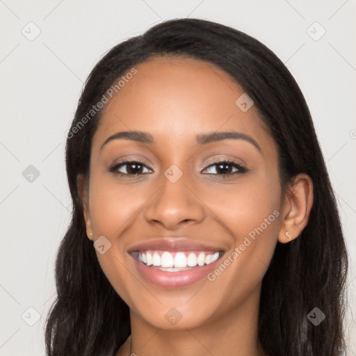 Joyful latino young-adult female with long  black hair and brown eyes