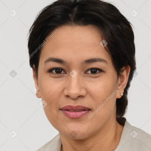 Joyful asian adult female with short  brown hair and brown eyes