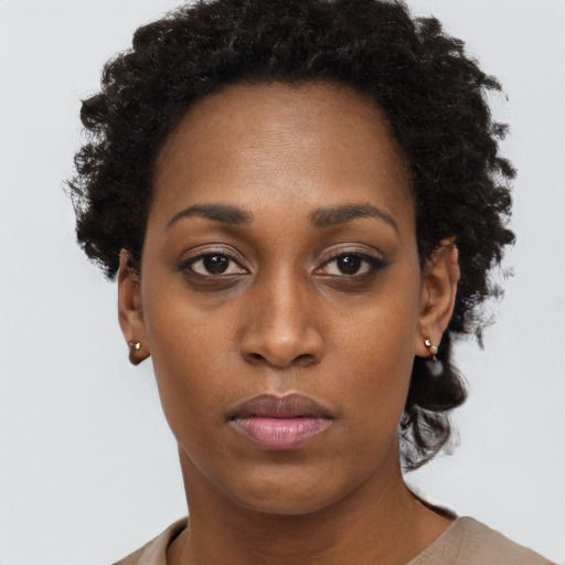 Neutral black young-adult female with short  brown hair and brown eyes