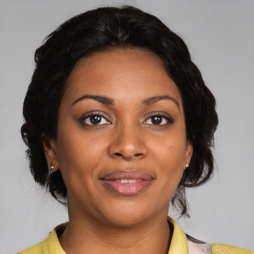 Joyful black young-adult female with medium  black hair and brown eyes