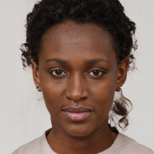 Neutral black young-adult female with short  black hair and brown eyes