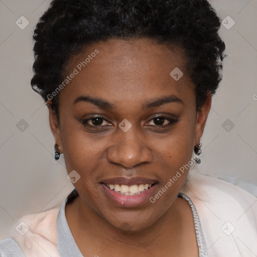 Joyful black young-adult female with short  black hair and brown eyes