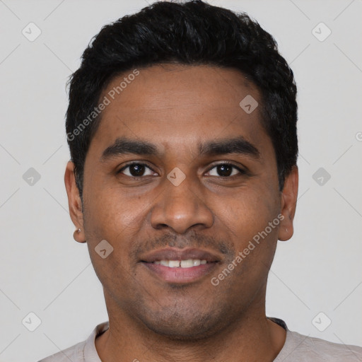 Joyful black young-adult male with short  black hair and brown eyes