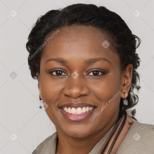 Joyful black young-adult female with long  brown hair and brown eyes