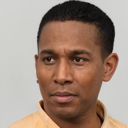Neutral latino young-adult male with short  black hair and brown eyes