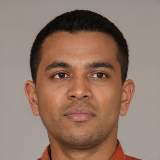 Neutral latino young-adult male with short  brown hair and brown eyes