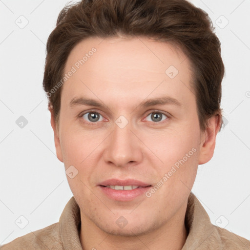 Joyful white adult male with short  brown hair and grey eyes