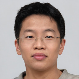 Neutral asian young-adult male with short  brown hair and brown eyes