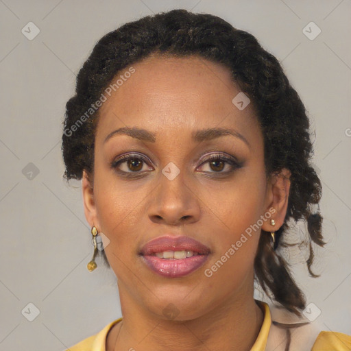 Joyful black adult female with short  brown hair and brown eyes