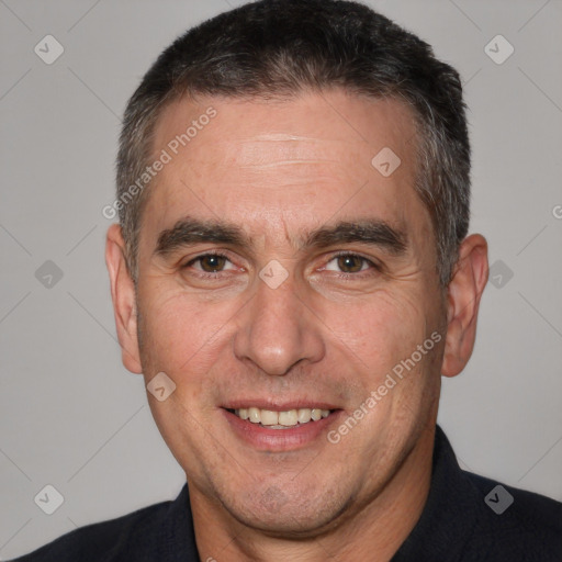 Joyful white adult male with short  brown hair and brown eyes