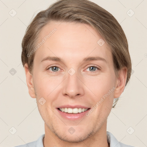 Joyful white adult female with short  brown hair and grey eyes