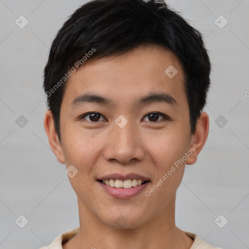 Joyful asian young-adult male with short  black hair and brown eyes