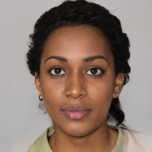 Neutral black young-adult female with short  black hair and brown eyes