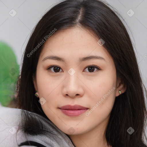 Joyful asian young-adult female with long  brown hair and brown eyes