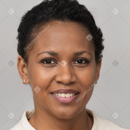 Joyful black adult female with short  brown hair and brown eyes