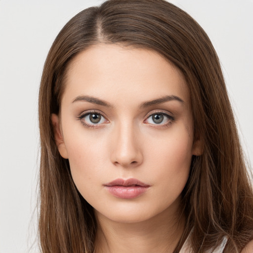 Neutral white young-adult female with long  brown hair and brown eyes