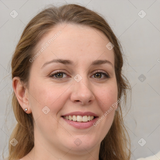 Joyful white young-adult female with medium  brown hair and blue eyes