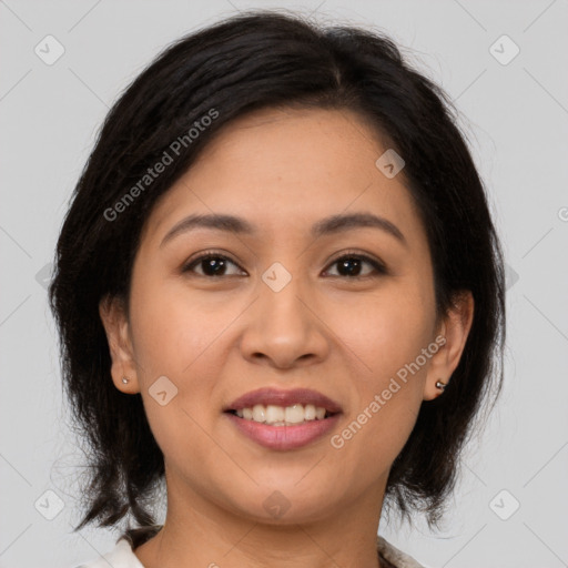 Joyful latino young-adult female with medium  brown hair and brown eyes