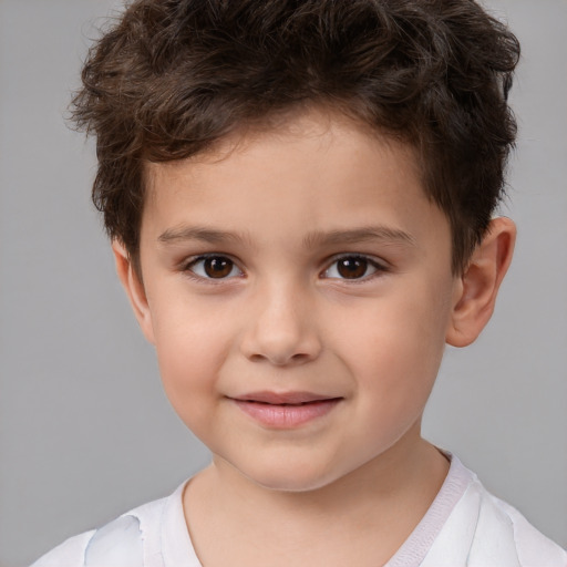 Joyful white child male with short  brown hair and brown eyes