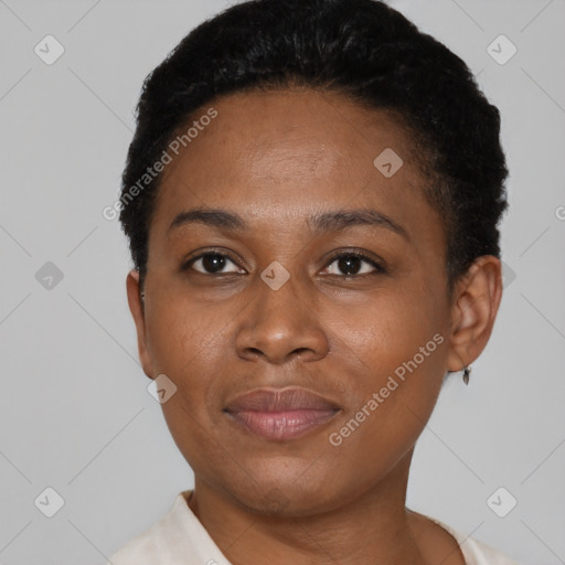 Joyful black young-adult female with short  black hair and brown eyes