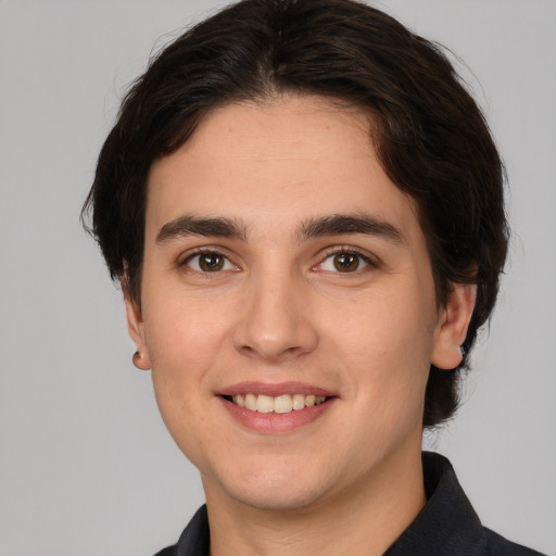 Joyful white young-adult male with medium  brown hair and brown eyes