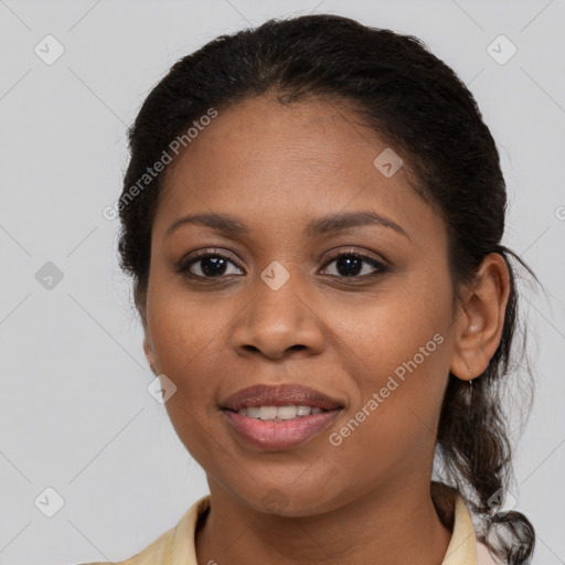 Joyful black young-adult female with medium  brown hair and brown eyes