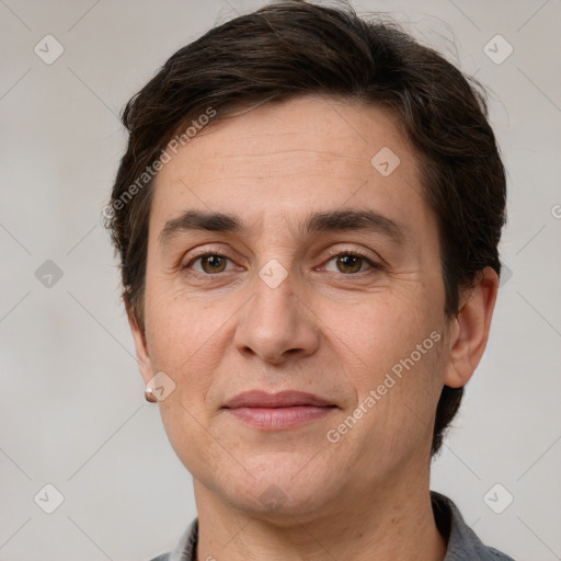 Joyful white adult male with short  brown hair and brown eyes