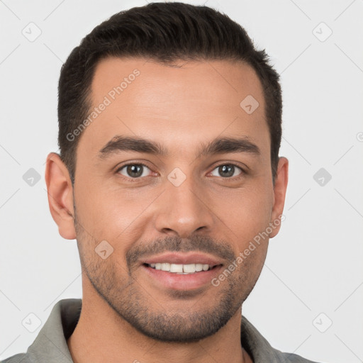 Joyful white young-adult male with short  brown hair and brown eyes