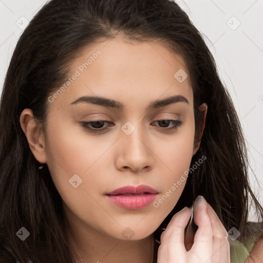 Neutral white young-adult female with long  brown hair and brown eyes