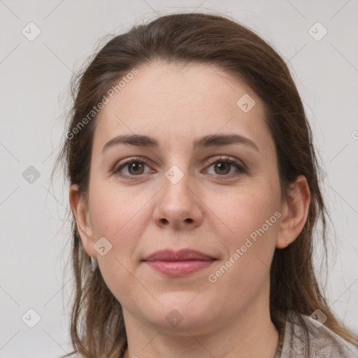 Joyful white young-adult female with medium  brown hair and grey eyes