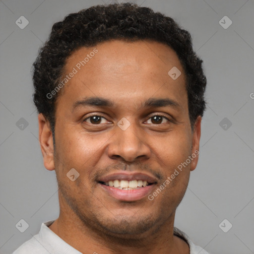 Joyful latino young-adult male with short  brown hair and brown eyes