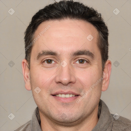 Joyful white adult male with short  brown hair and brown eyes